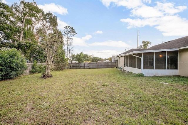 view of yard with a sunroom