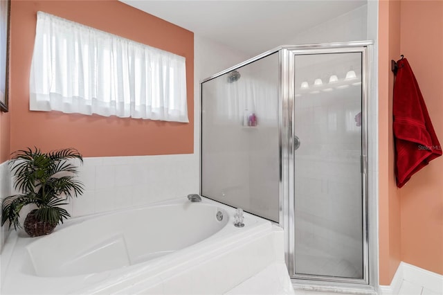 bathroom with shower with separate bathtub