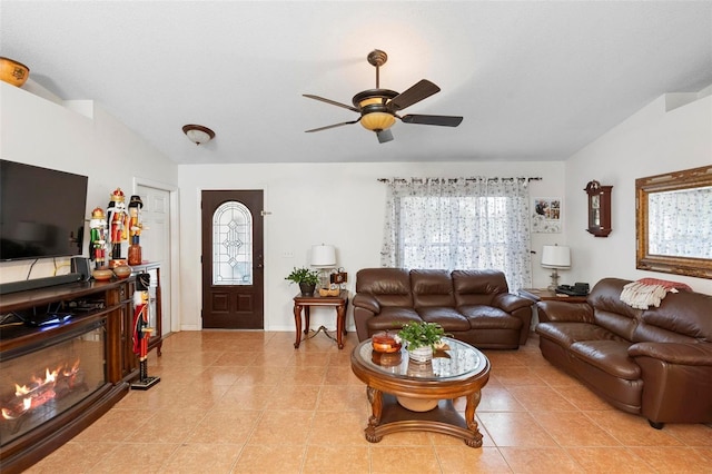 living room with ceiling fan and light tile patterned floors