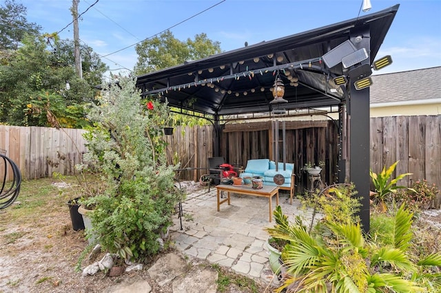 view of patio with a gazebo and outdoor lounge area