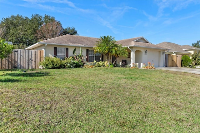 ranch-style house with a front lawn and a garage