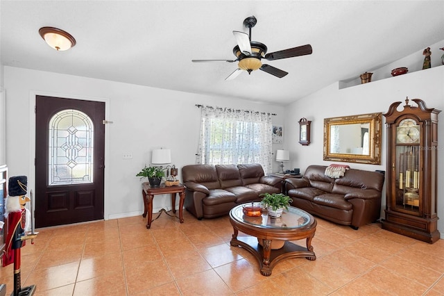 tiled living room featuring ceiling fan and lofted ceiling