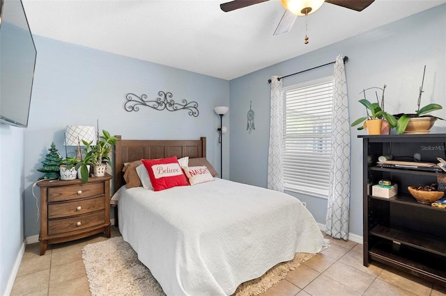 tiled bedroom with ceiling fan