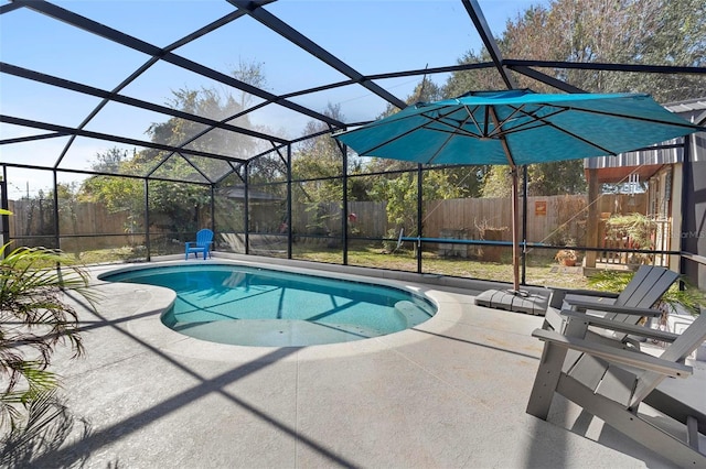 view of swimming pool with a lanai and a patio area