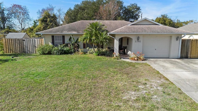 single story home featuring a garage and a front yard