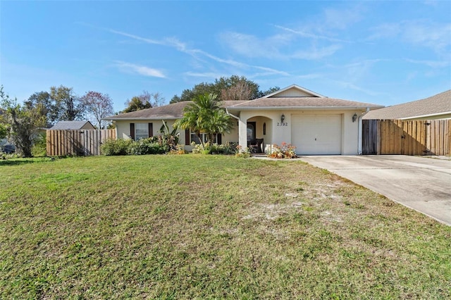 ranch-style home with a garage and a front lawn