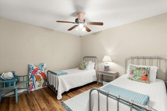 bedroom featuring dark hardwood / wood-style floors and ceiling fan