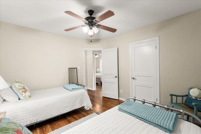 bedroom featuring dark hardwood / wood-style flooring and ceiling fan