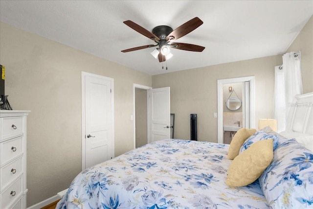 bedroom with ensuite bathroom and ceiling fan