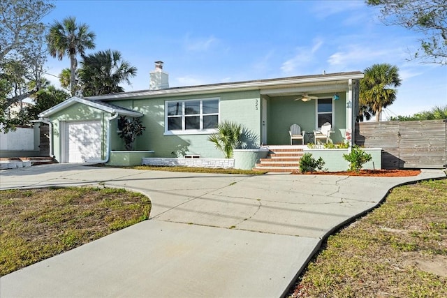 single story home with a porch and a garage