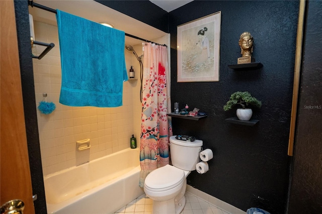 bathroom featuring tile patterned flooring, shower / tub combo, and toilet