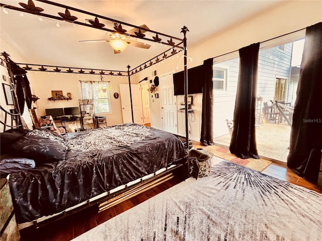 bedroom with hardwood / wood-style flooring and ceiling fan