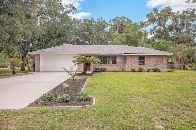 ranch-style house featuring a front yard and a garage