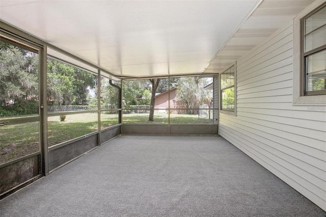 unfurnished sunroom featuring a wealth of natural light