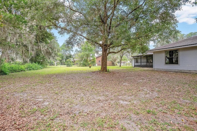 view of yard featuring a sunroom