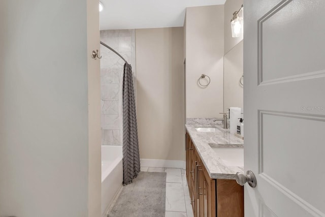 bathroom featuring shower / bath combo and vanity