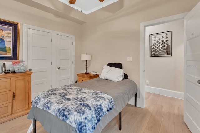 bedroom with ceiling fan and light hardwood / wood-style floors