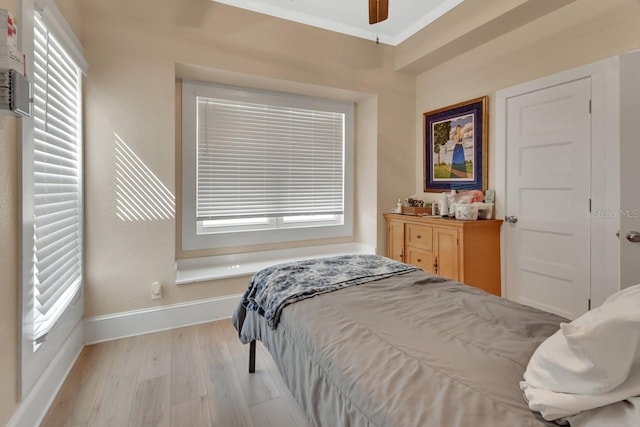 bedroom featuring light hardwood / wood-style flooring and ceiling fan