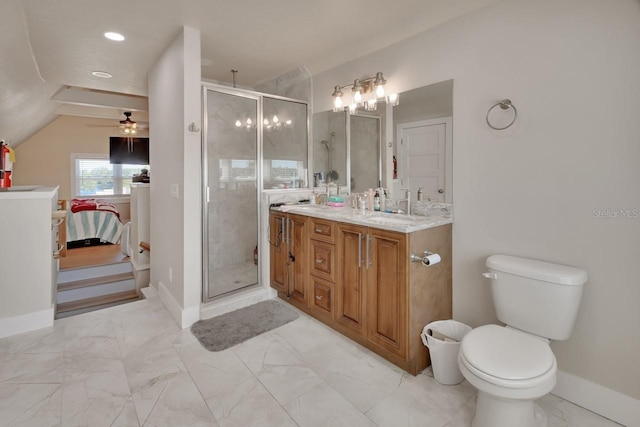 bathroom with vanity, toilet, ceiling fan, and a shower with shower door