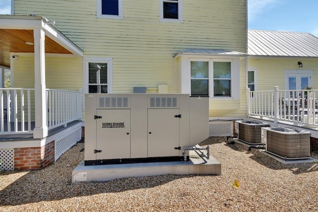 rear view of property featuring central air condition unit