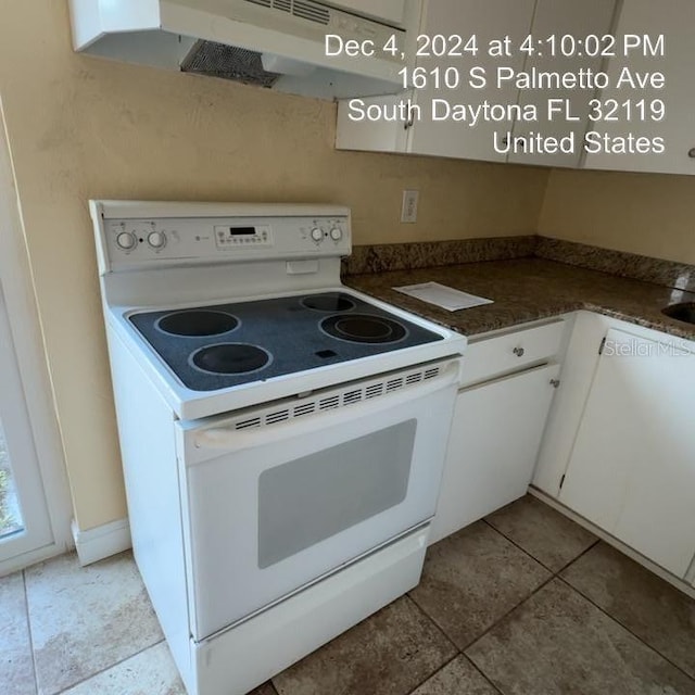 kitchen with white cabinetry and white electric range oven