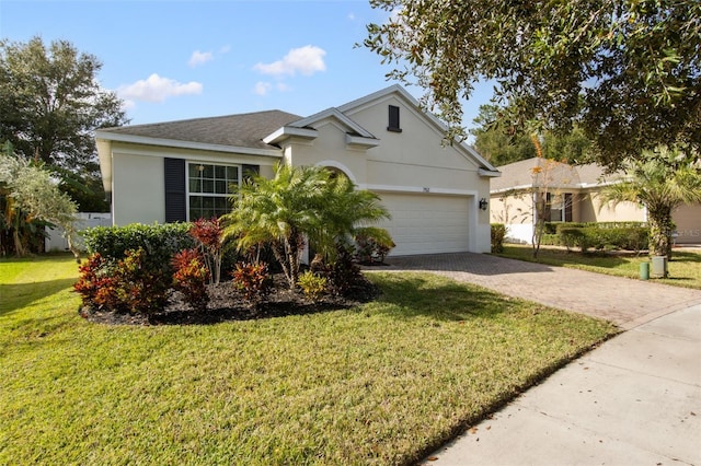 view of front facade featuring a front yard and a garage