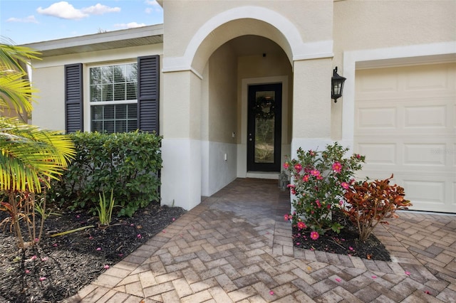 property entrance with a garage