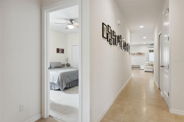 hallway featuring light tile patterned floors