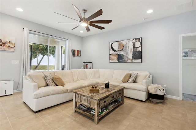 living room featuring ceiling fan and light tile patterned flooring