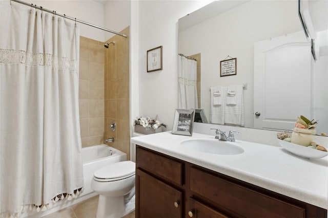 full bathroom with tile patterned floors, shower / bath combo with shower curtain, vanity, and toilet