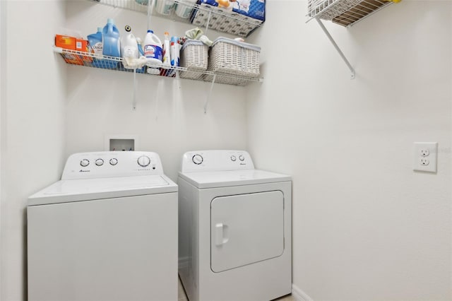 washroom featuring washing machine and dryer