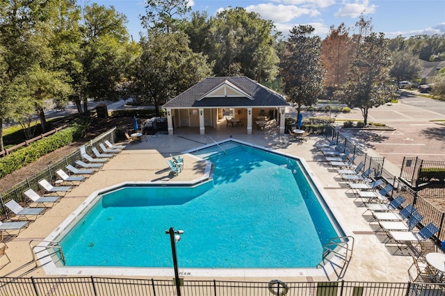 view of swimming pool with a patio