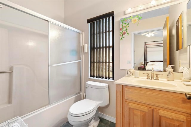 full bathroom with toilet, enclosed tub / shower combo, and vanity