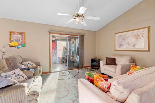 carpeted living room featuring lofted ceiling and ceiling fan