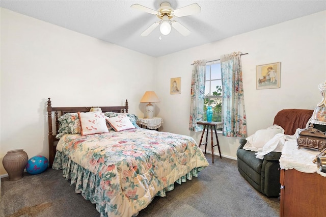 carpeted bedroom featuring ceiling fan and a textured ceiling