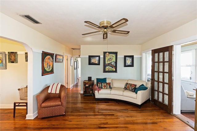 living room with hardwood / wood-style floors and ceiling fan