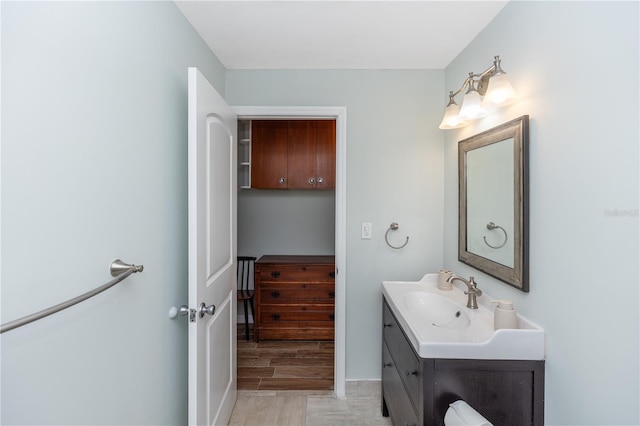 bathroom featuring hardwood / wood-style flooring and vanity