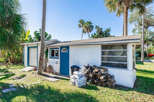 view of outbuilding with a lawn