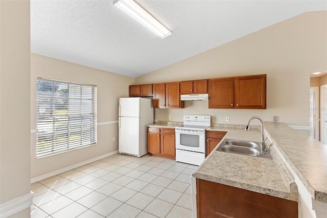 kitchen featuring vaulted ceiling, sink, light tile patterned flooring, and white appliances