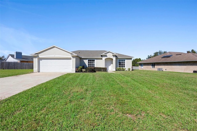 ranch-style home with a front yard and a garage