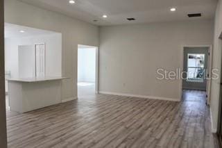 empty room featuring hardwood / wood-style flooring