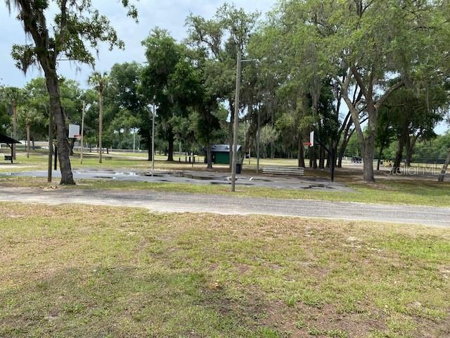 view of property's community with a lawn