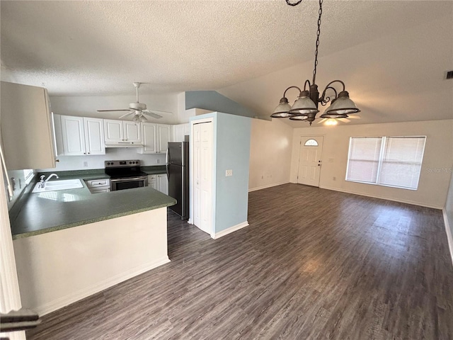 kitchen featuring stainless steel appliances, dark wood-type flooring, white cabinetry, hanging light fixtures, and lofted ceiling