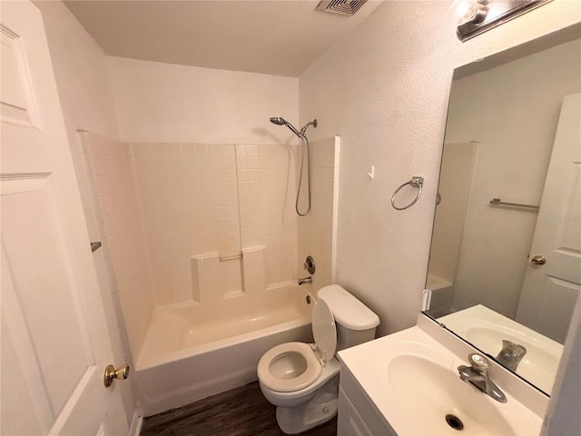 full bathroom with vanity, toilet, wood-type flooring, and tub / shower combination