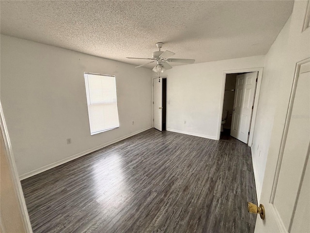 unfurnished bedroom with a textured ceiling, ceiling fan, and dark hardwood / wood-style floors