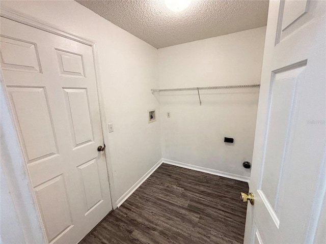 laundry area with electric dryer hookup, dark hardwood / wood-style flooring, washer hookup, and a textured ceiling