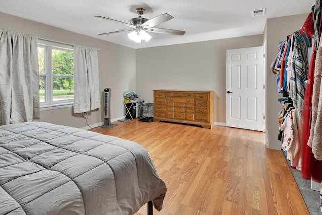 bedroom with hardwood / wood-style floors and ceiling fan