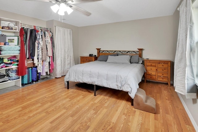 bedroom featuring ceiling fan and wood-type flooring