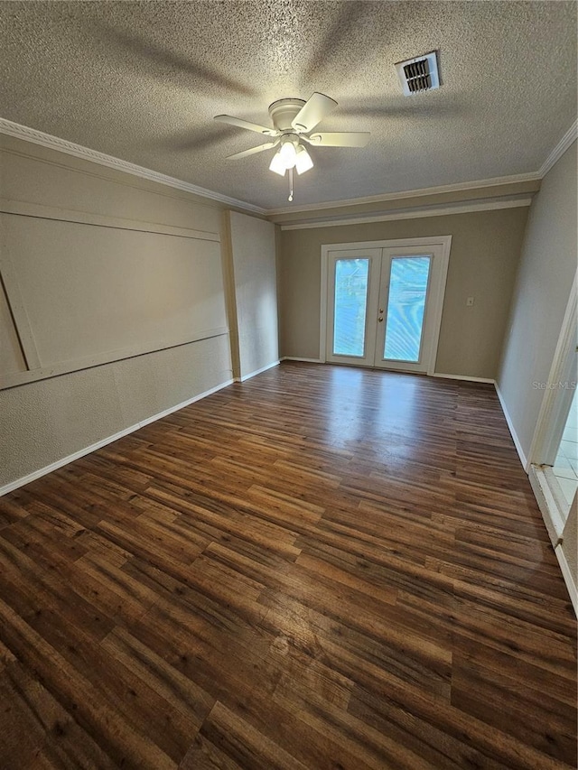 unfurnished room featuring ceiling fan, french doors, dark wood-type flooring, and a textured ceiling