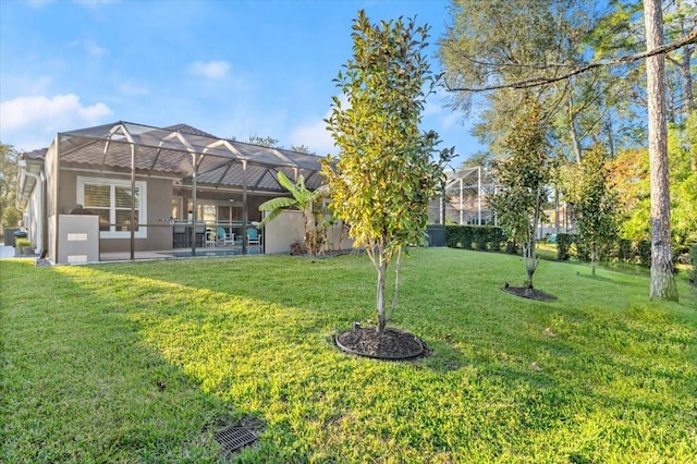 view of yard with a lanai and a patio